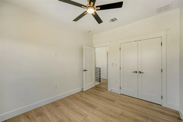 a view of room with hardwood floor and window
