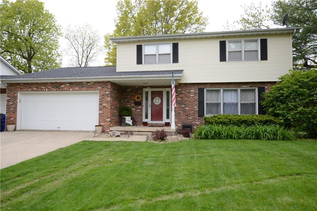 821 West Karen Drive Decatur, IL 62526 - Photo 1 of 1 a front view of a house with a garden and plants