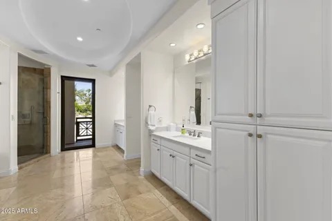 a large bathroom with a double vanity sink and a mirror