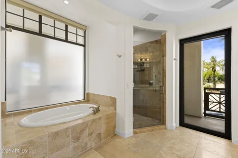 a bathroom with a bathtub and a shower