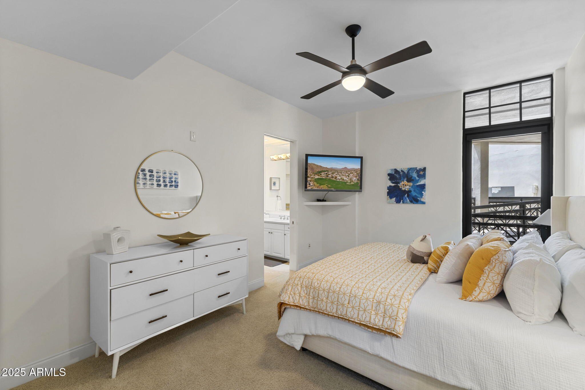 8 Biltmore Estate, Unit 215 Phoenix, AZ 85016 - Photo 19 of 26 a bedroom with a bed and a chandelier