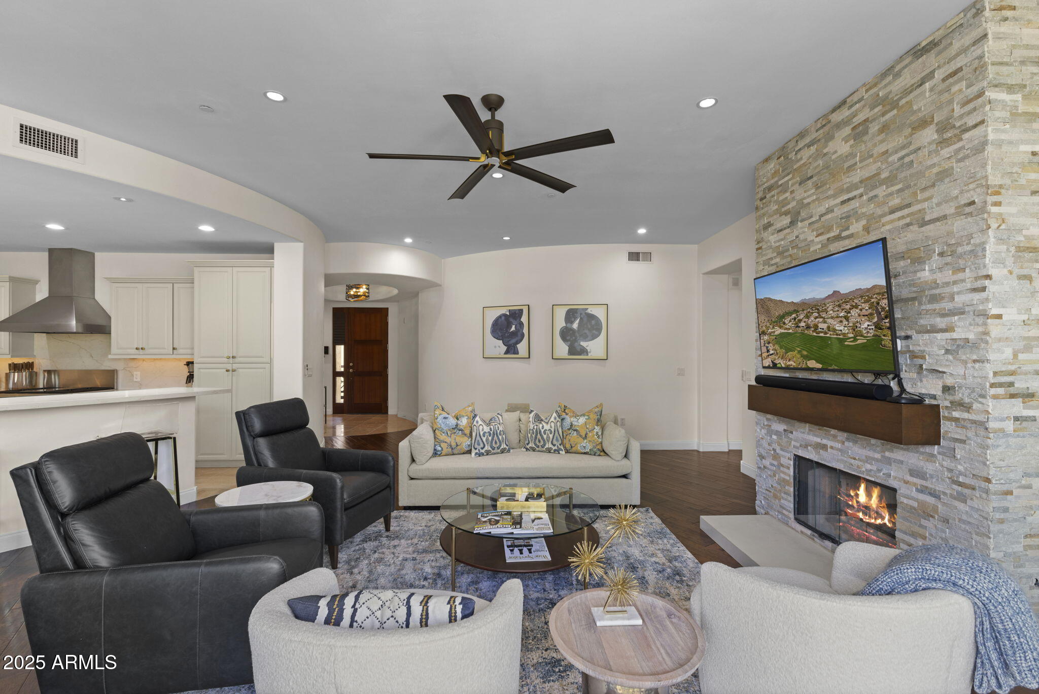 8 Biltmore Estate, Unit 215 Phoenix, AZ 85016 - Photo 4 of 26 a living room with furniture and a flat screen tv