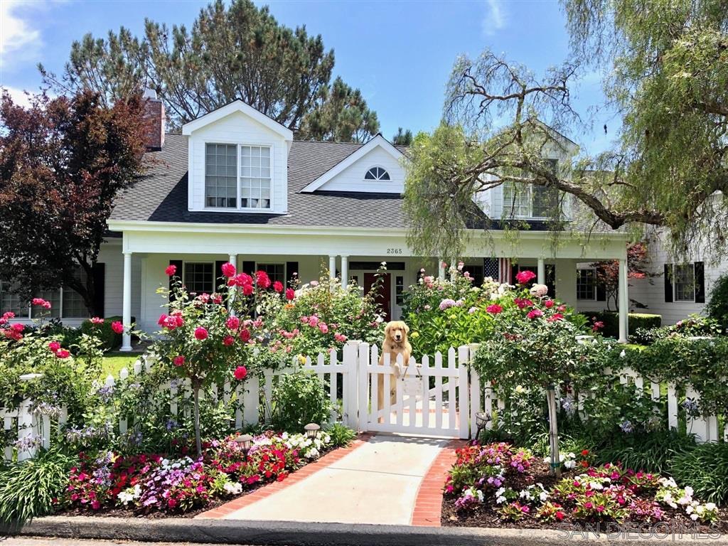 2365 Jennifer Lane Encinitas, CA 92024 - Photo 2 of 25 a front view of the house with a lot of flowers and trees