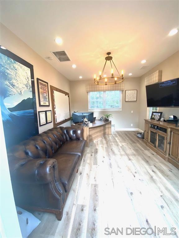 2365 Jennifer Lane Encinitas, CA 92024 - Photo 20 of 25 a living room with furniture and a flat screen tv