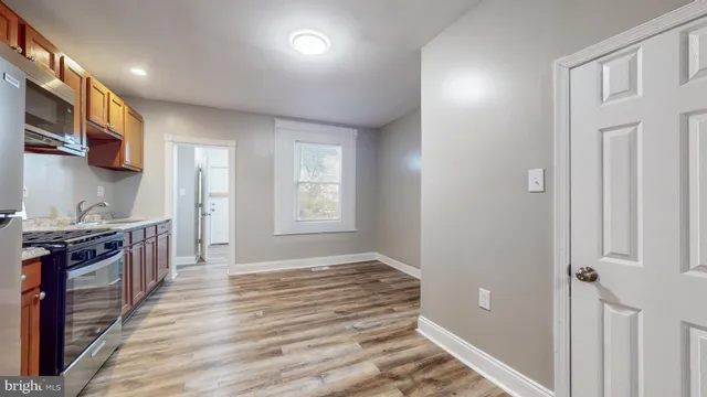 a view of a kitchen from the hallway