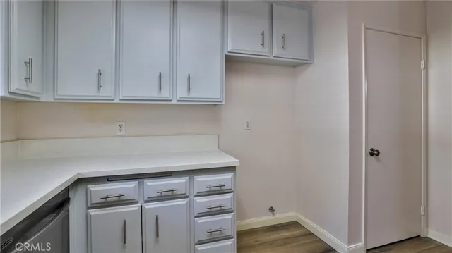 a view of cabinets and wooden floor