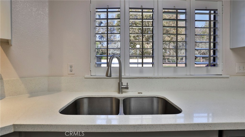 26 Willowcrest Lane Phillips Ranch, CA 91766 - Photo 12 of 39 a kitchen with a sink and cabinets