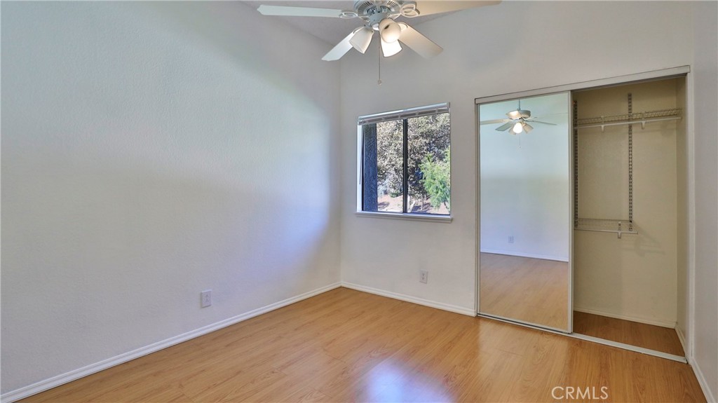 26 Willowcrest Lane Phillips Ranch, CA 91766 - Photo 19 of 39 an empty room with wooden floor closet and windows