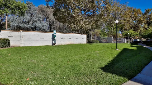 an aerial view of a house with swimming pool and outdoor space