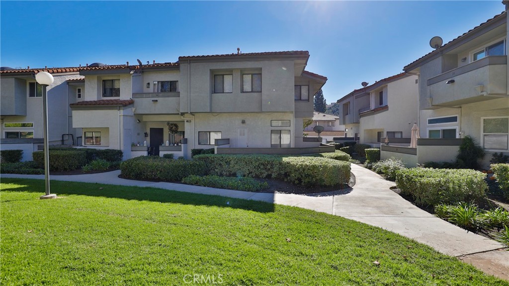 26 Willowcrest Lane Phillips Ranch, CA 91766 - Photo 28 of 39 a front view of a house with a yard