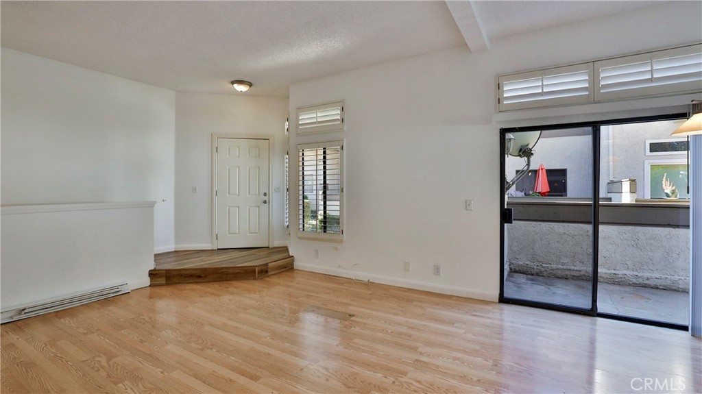 26 Willowcrest Lane Phillips Ranch, CA 91766 - Photo 5 of 39 an empty room with wooden floor and windows
