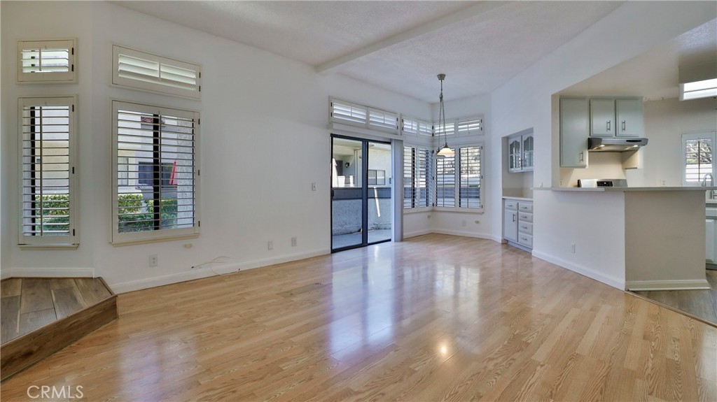 26 Willowcrest Lane Phillips Ranch, CA 91766 - Photo 6 of 39 a view of an empty room with window and wooden floor