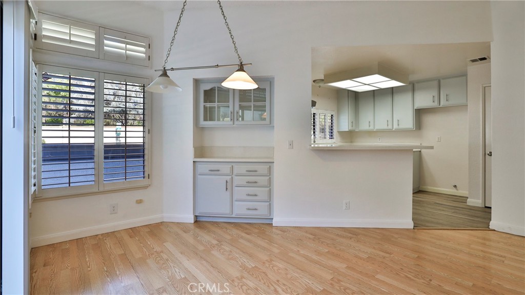 26 Willowcrest Lane Phillips Ranch, CA 91766 - Photo 7 of 39 an empty room with chandelier fan and windows