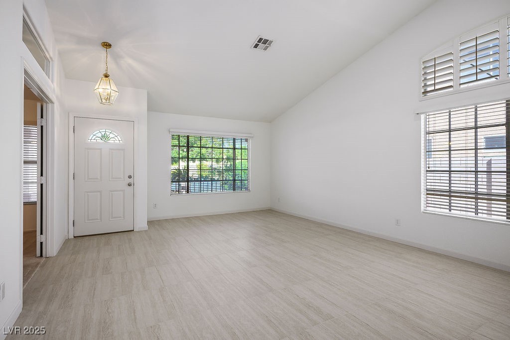 1812 Jack Rabbit Way Las Vegas, NV 89128 - Photo 11 of 44 Newly installed tile flooring all through out the living, dining, kitchen, family room, and hallways
