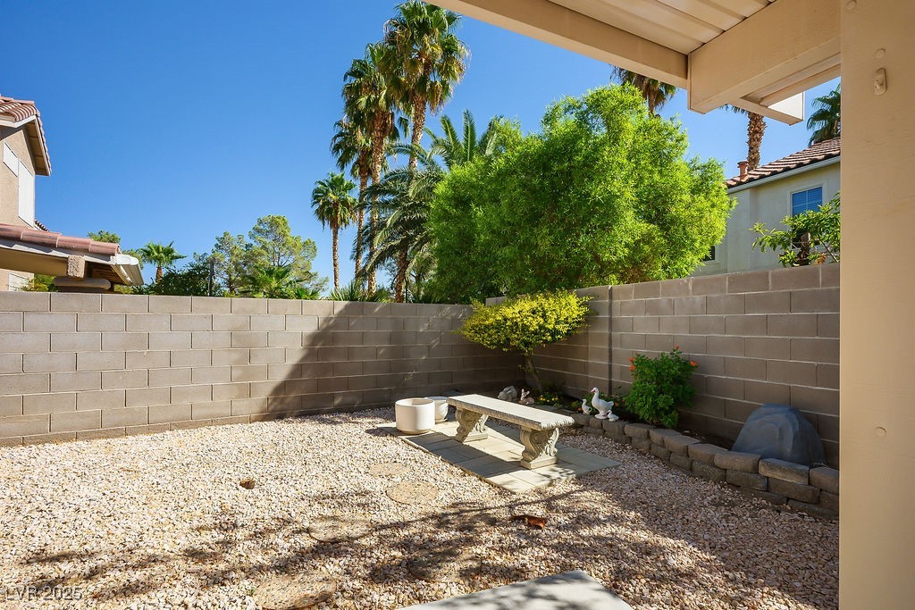 1812 Jack Rabbit Way Las Vegas, NV 89128 - Photo 20 of 44 Fenced backyard with a covered patio