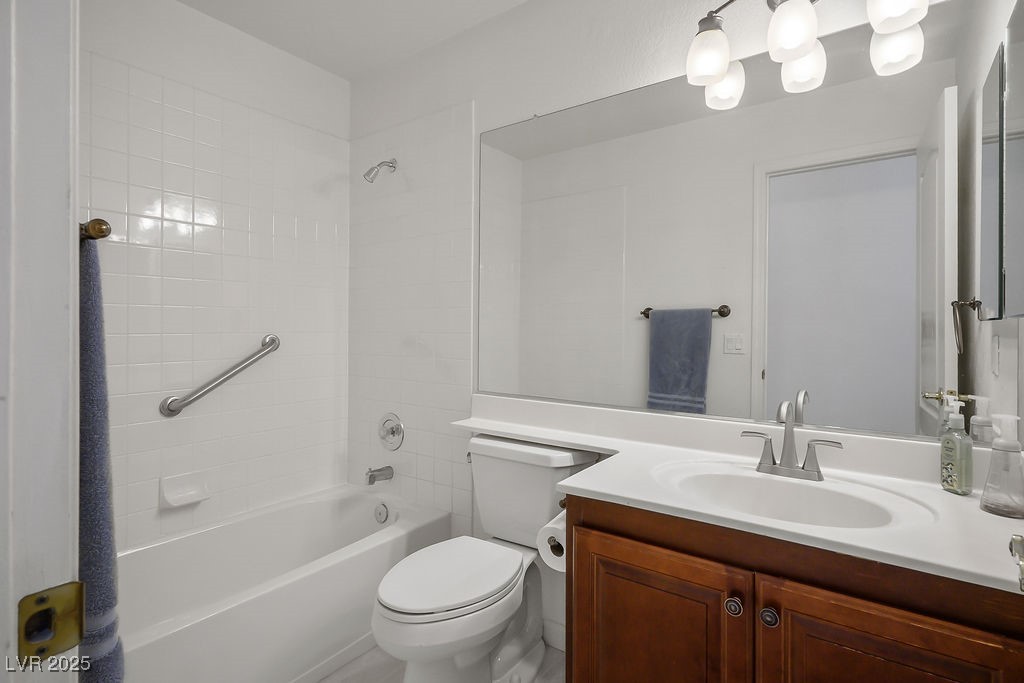 1812 Jack Rabbit Way Las Vegas, NV 89128 - Photo 26 of 44 Bathroom featuring shower / bath combination with vanity