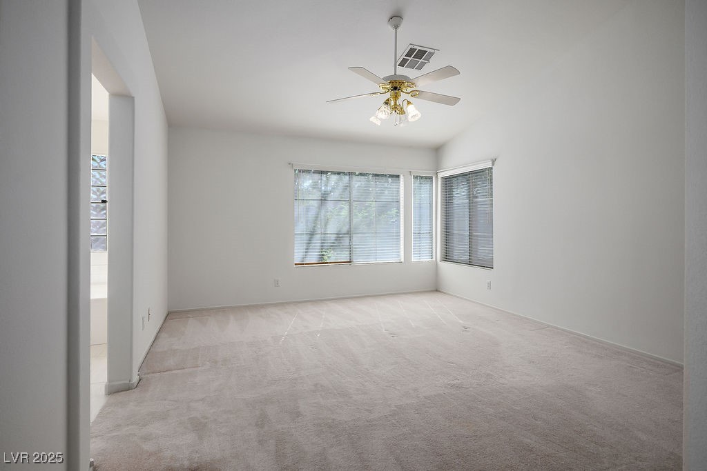 1812 Jack Rabbit Way Las Vegas, NV 89128 - Photo 27 of 44 Master's bedroom featuring light colored carpet, and ceiling fan