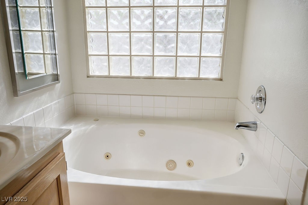 1812 Jack Rabbit Way Las Vegas, NV 89128 - Photo 33 of 44 Bathroom featuring a whirlpool tub and vanity