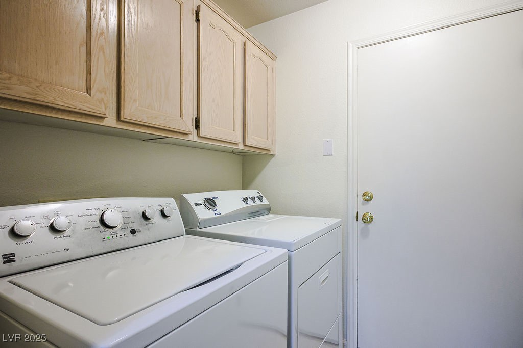 1812 Jack Rabbit Way Las Vegas, NV 89128 - Photo 36 of 44 Laundry area featuring independent washer and dryer and cabinet space