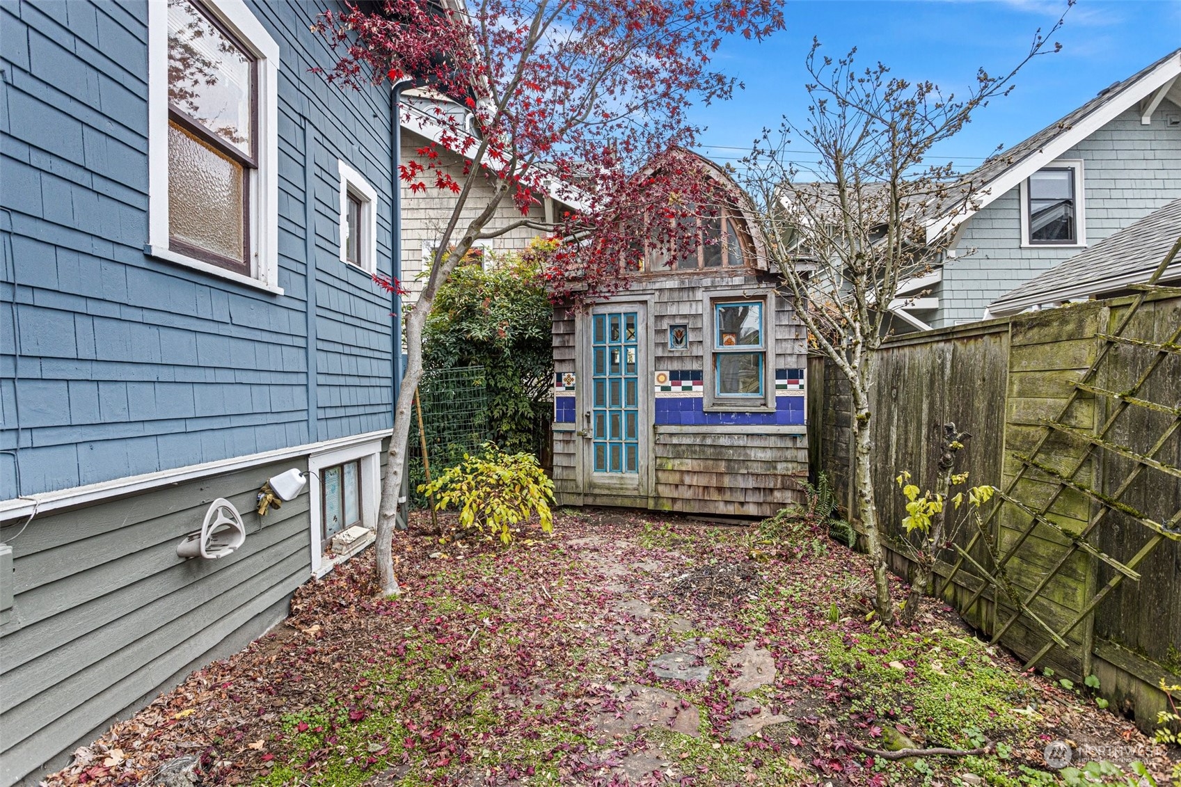 4228 Eastern Avenue North Seattle, WA 98103 - Photo 22 of 27 a view of a house with a tree in the background