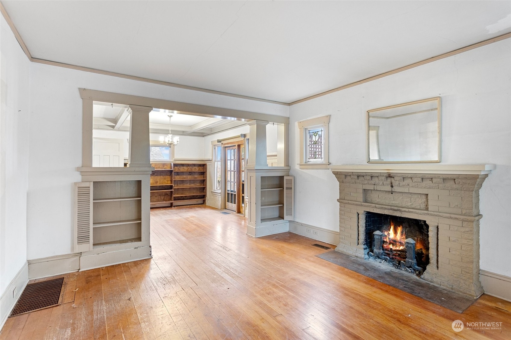 4228 Eastern Avenue North Seattle, WA 98103 - Photo 4 of 27 a view of a livingroom with wooden floor and a fireplace