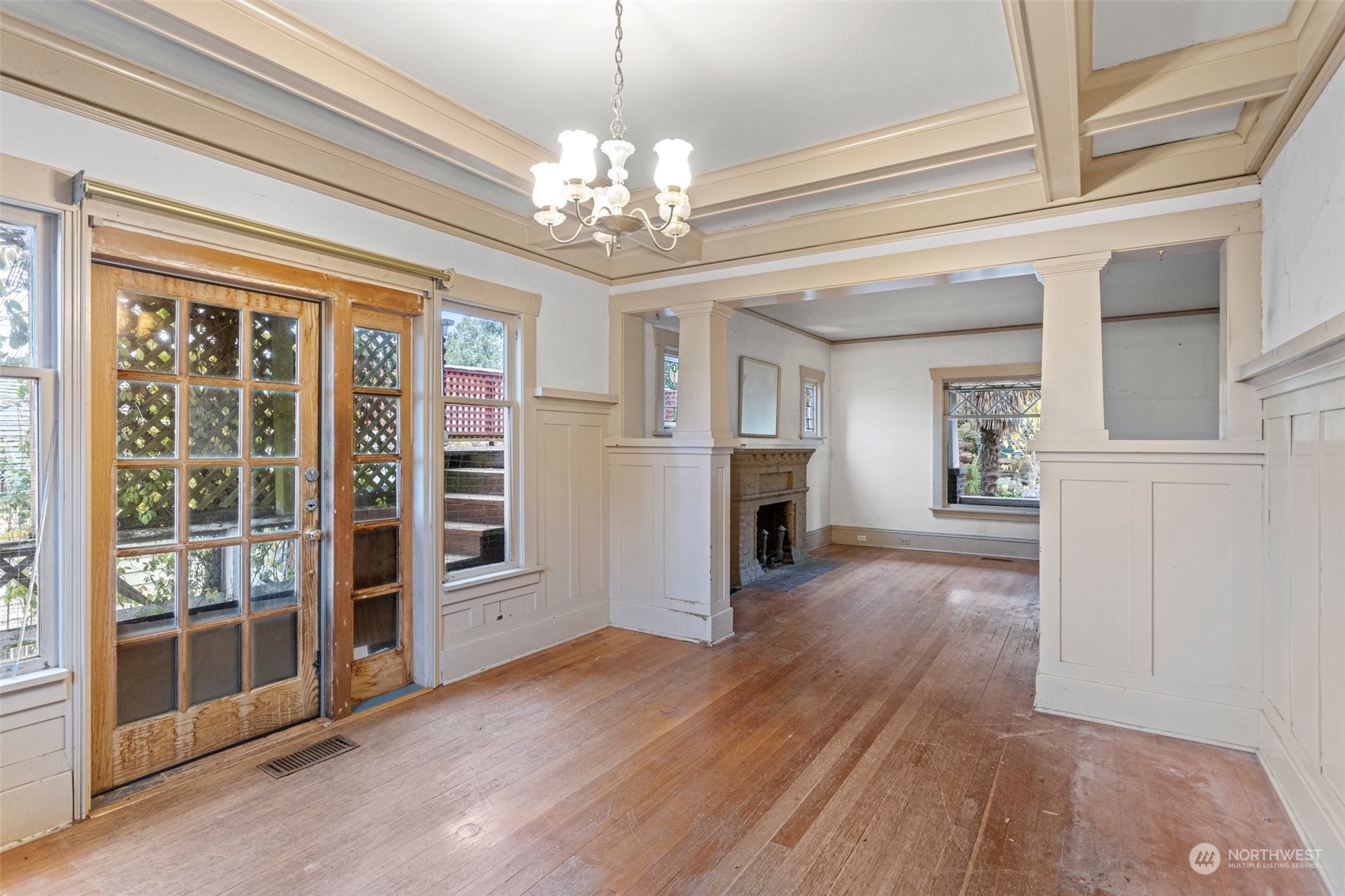 4228 Eastern Avenue North Seattle, WA 98103 - Photo 7 of 27 a view of a livingroom with a fireplace wooden floor and windows