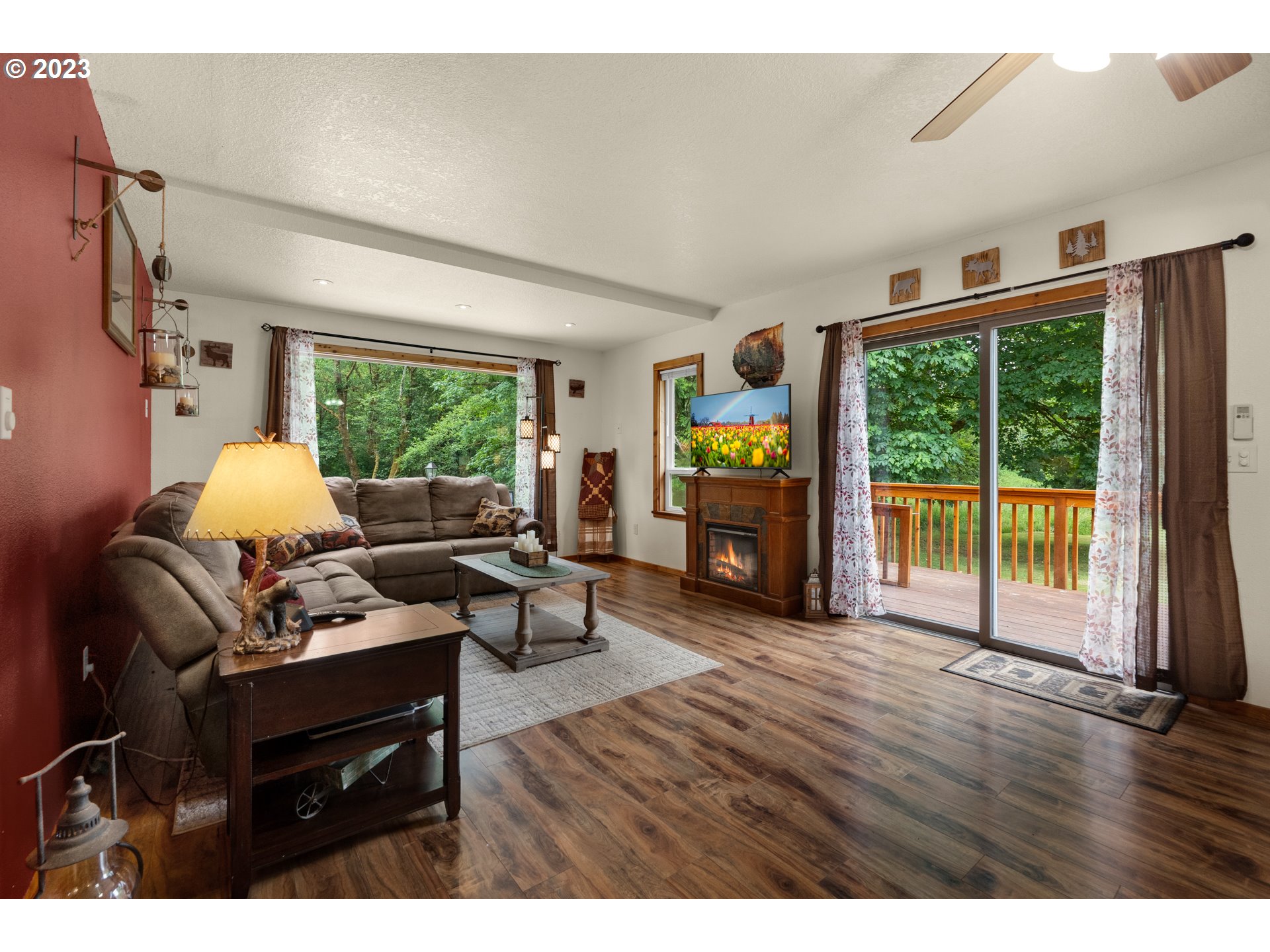 92357 Maki Road Astoria, OR 97103 - Photo 16 of 41 a living room with furniture and a floor to ceiling window