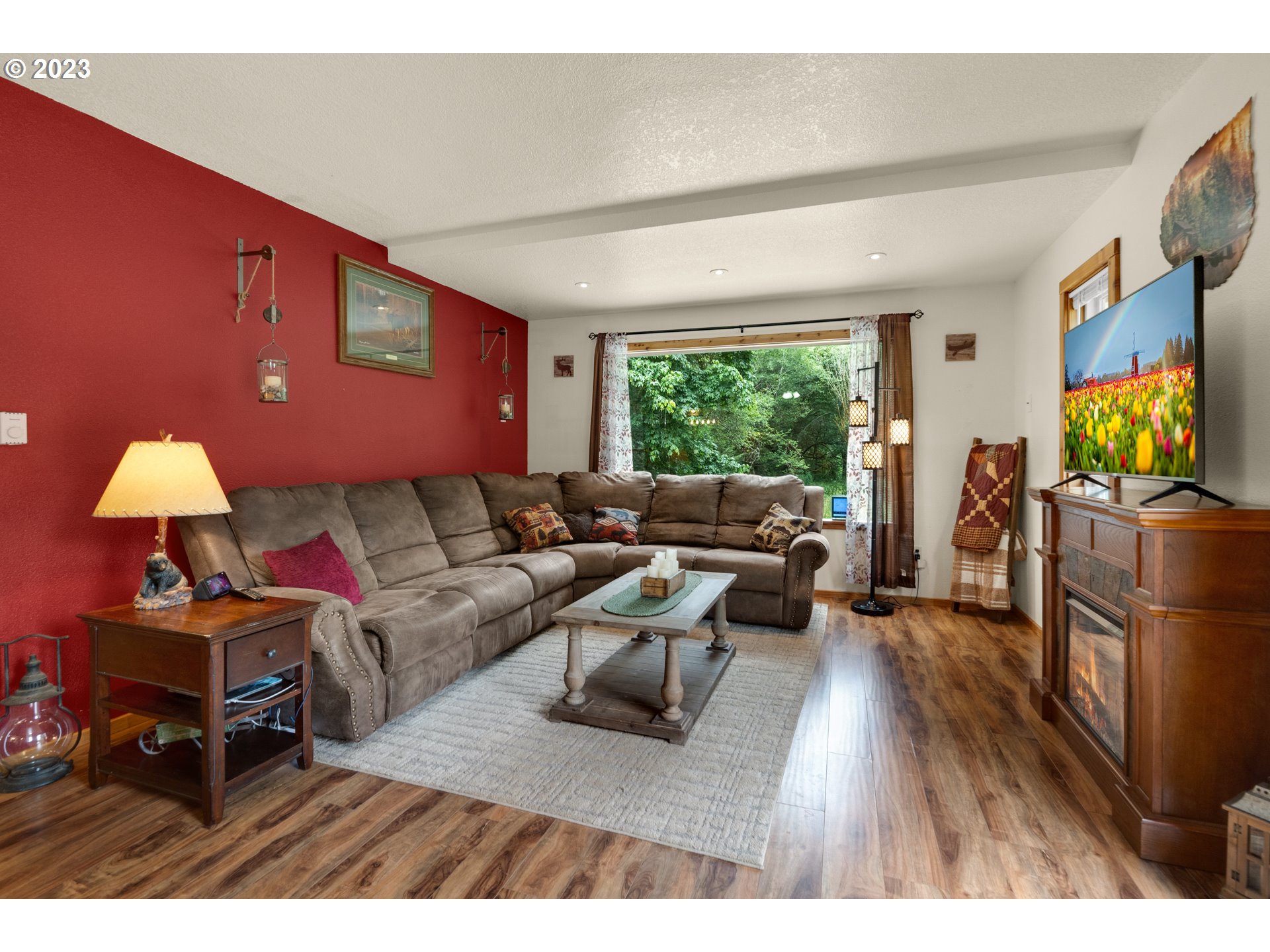 92357 Maki Road Astoria, OR 97103 - Photo 17 of 41 a living room with furniture and a flat screen tv