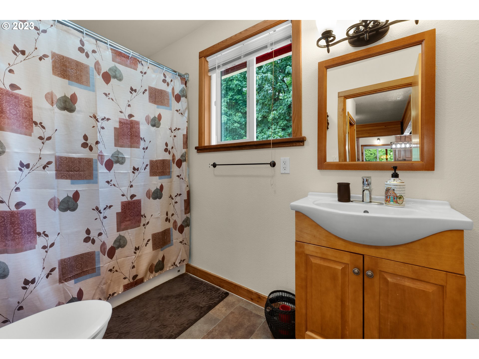 92357 Maki Road Astoria, OR 97103 - Photo 19 of 41 a bathroom with a sink and a mirror