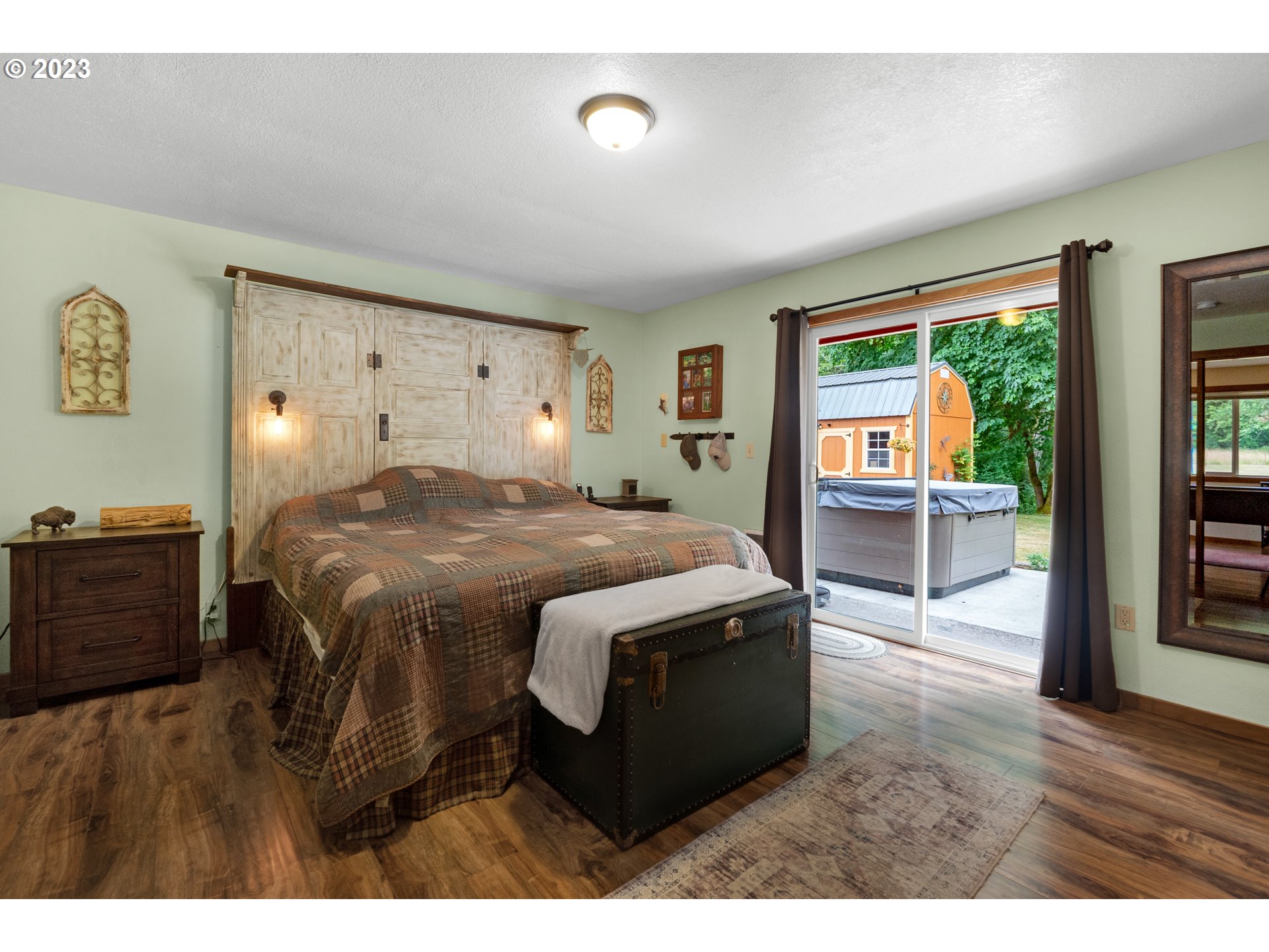 92357 Maki Road Astoria, OR 97103 - Photo 30 of 41 a bedroom with a bed and wooden floor