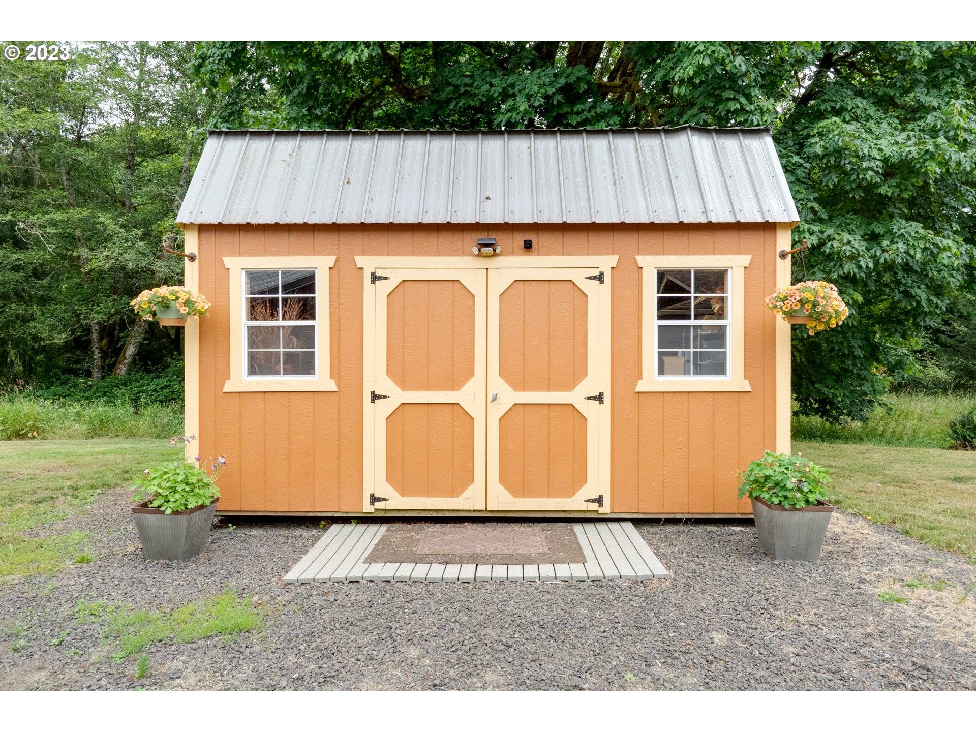 92357 Maki Road Astoria, OR 97103 - Photo 34 of 41 a aerial view of a house with a garden and yard