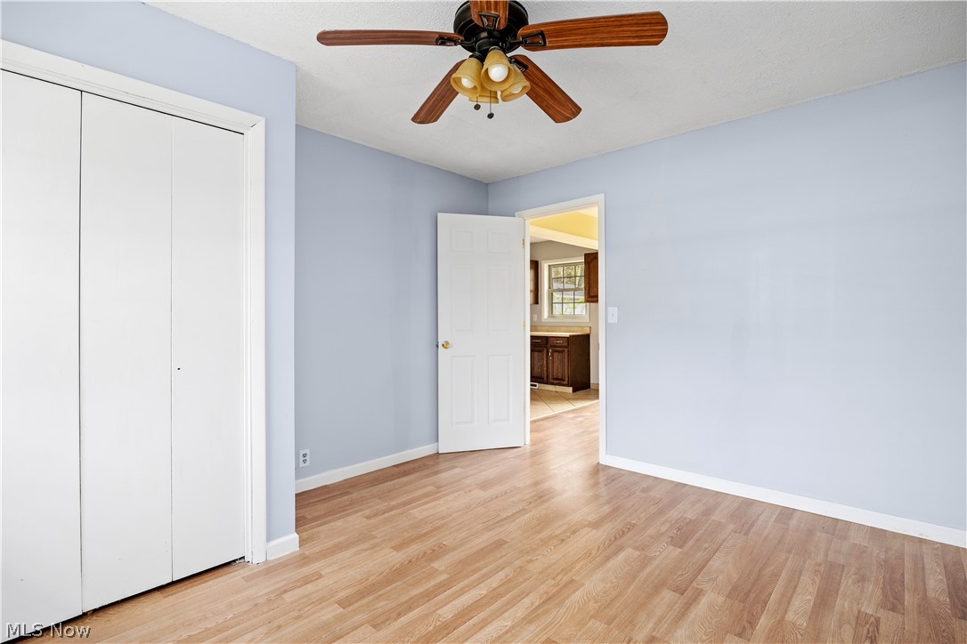 34067 Bainbridge Road North Ridgeville, OH 44039 - Photo 20 of 33 Unfurnished bedroom with a closet, ceiling fan, and light hardwood / wood-style floors
