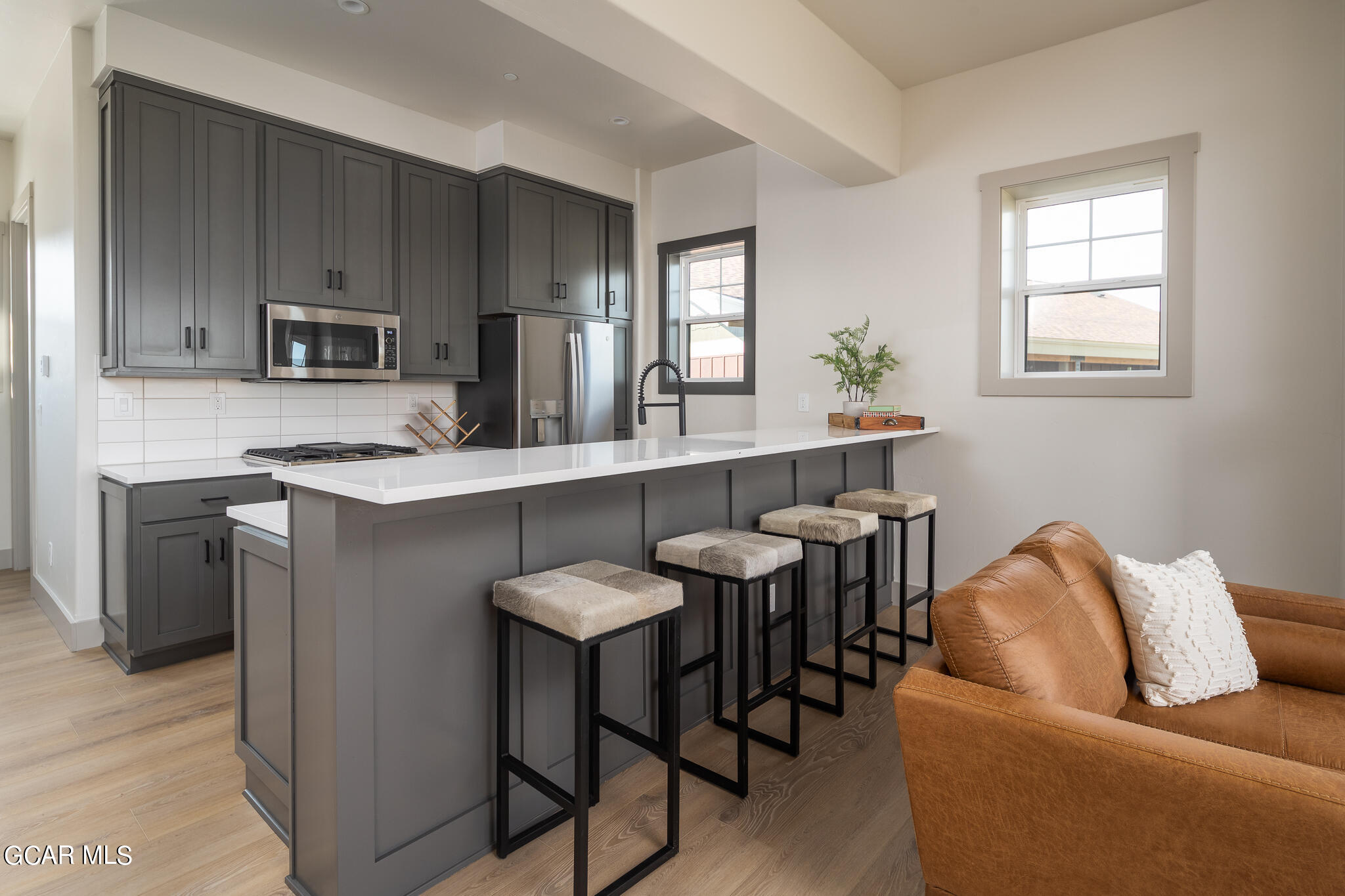 219 Eagle Ridge Circle Granby, CO 80446 - Photo 11 of 41 a living room with stainless steel appliances kitchen island furniture and wooden floor