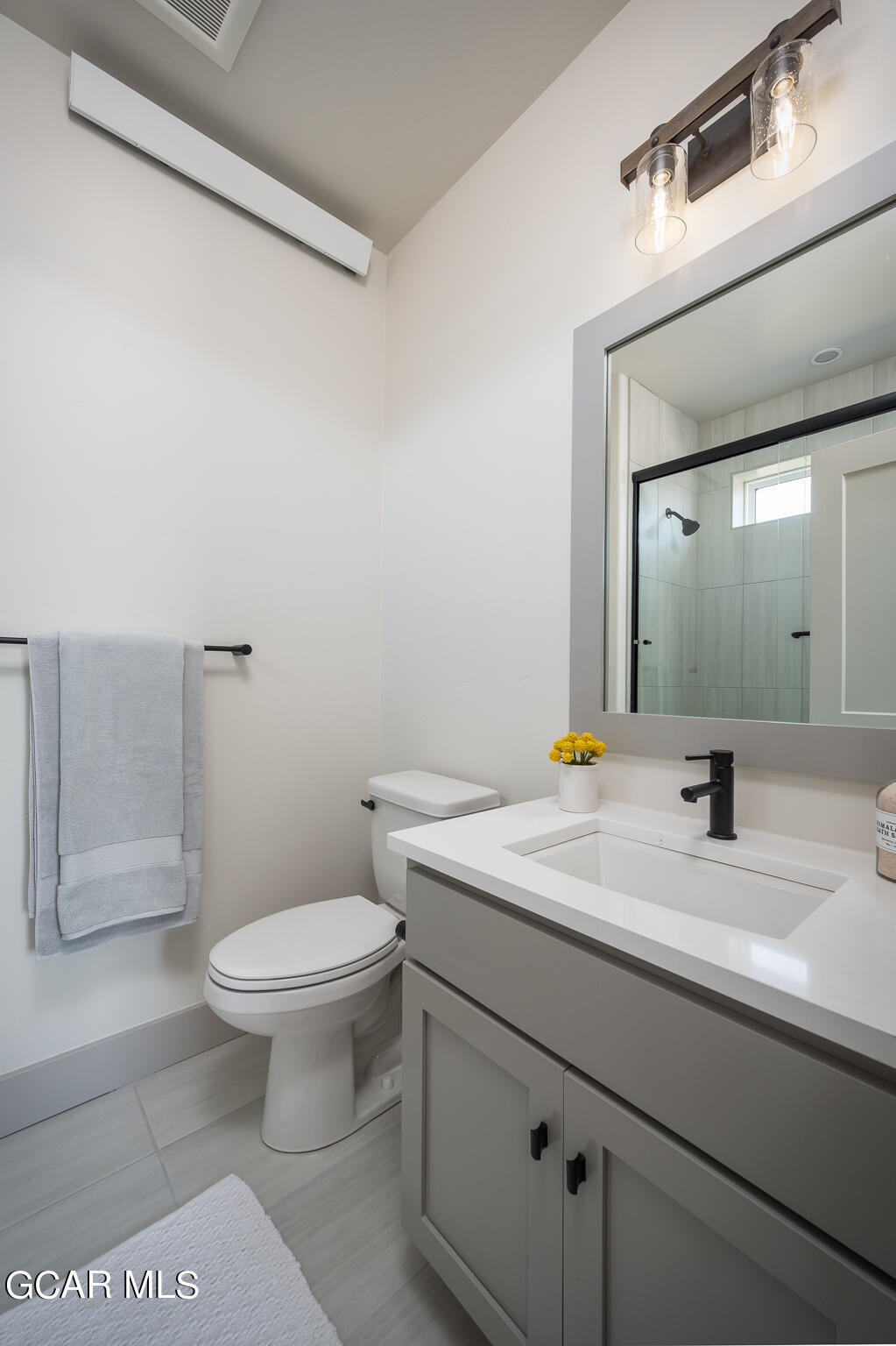 219 Eagle Ridge Circle Granby, CO 80446 - Photo 20 of 41 a bathroom with a sink a toilet and mirror