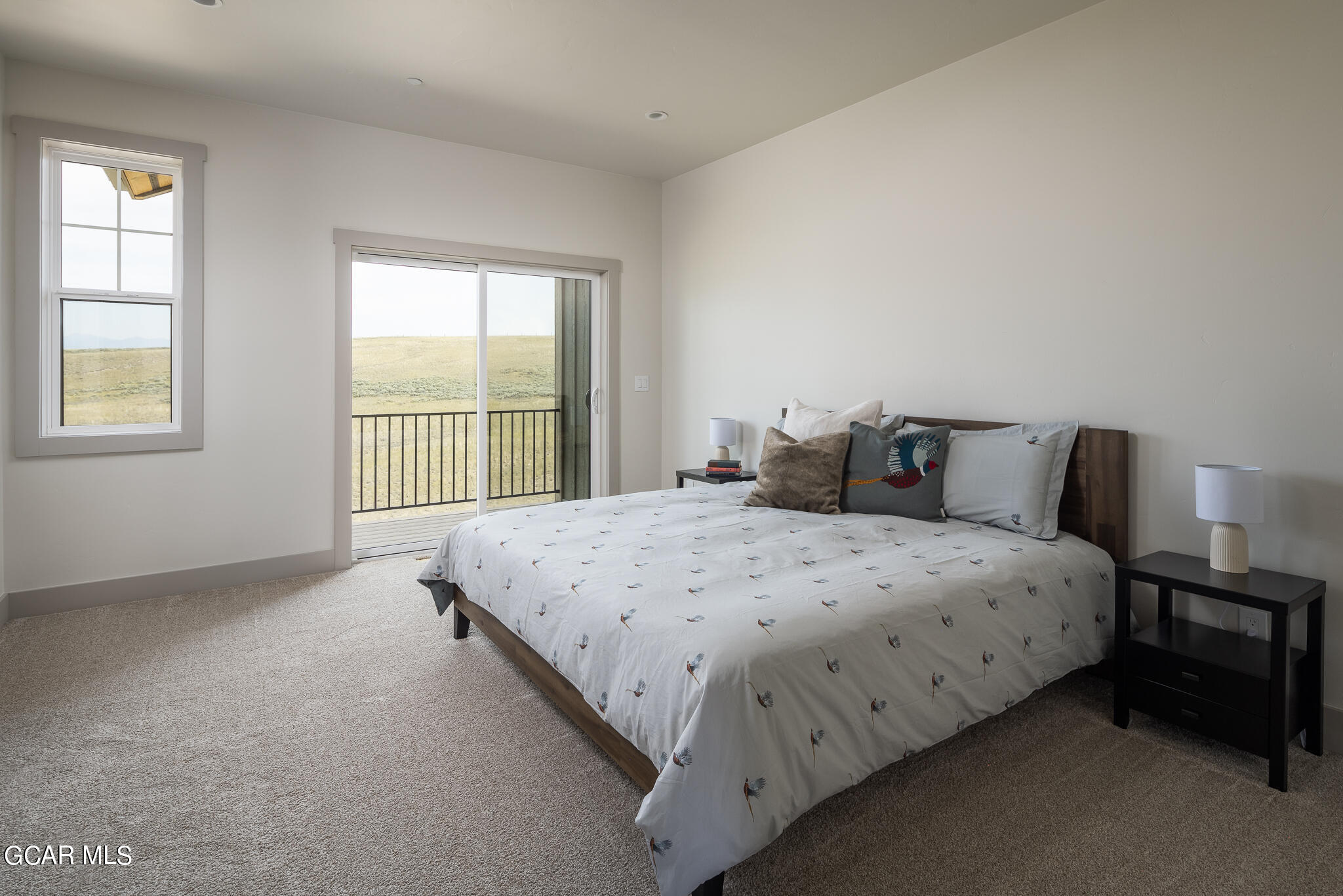219 Eagle Ridge Circle Granby, CO 80446 - Photo 21 of 41 a bedroom with a bed and a window