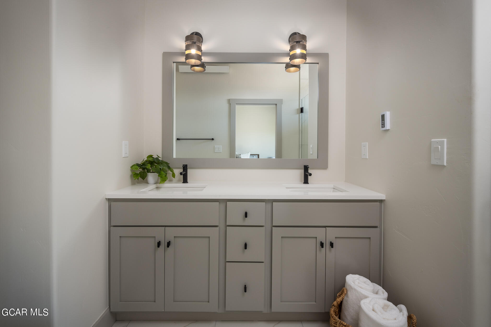 219 Eagle Ridge Circle Granby, CO 80446 - Photo 23 of 41 a bathroom with a sink vanity and mirror
