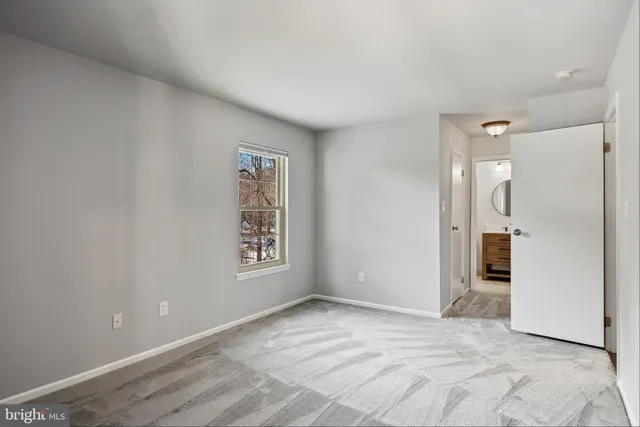 a view of an empty room and window