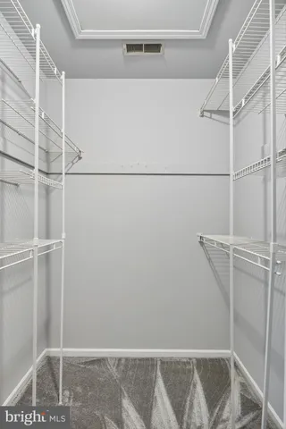 a view of an empty walk in closet