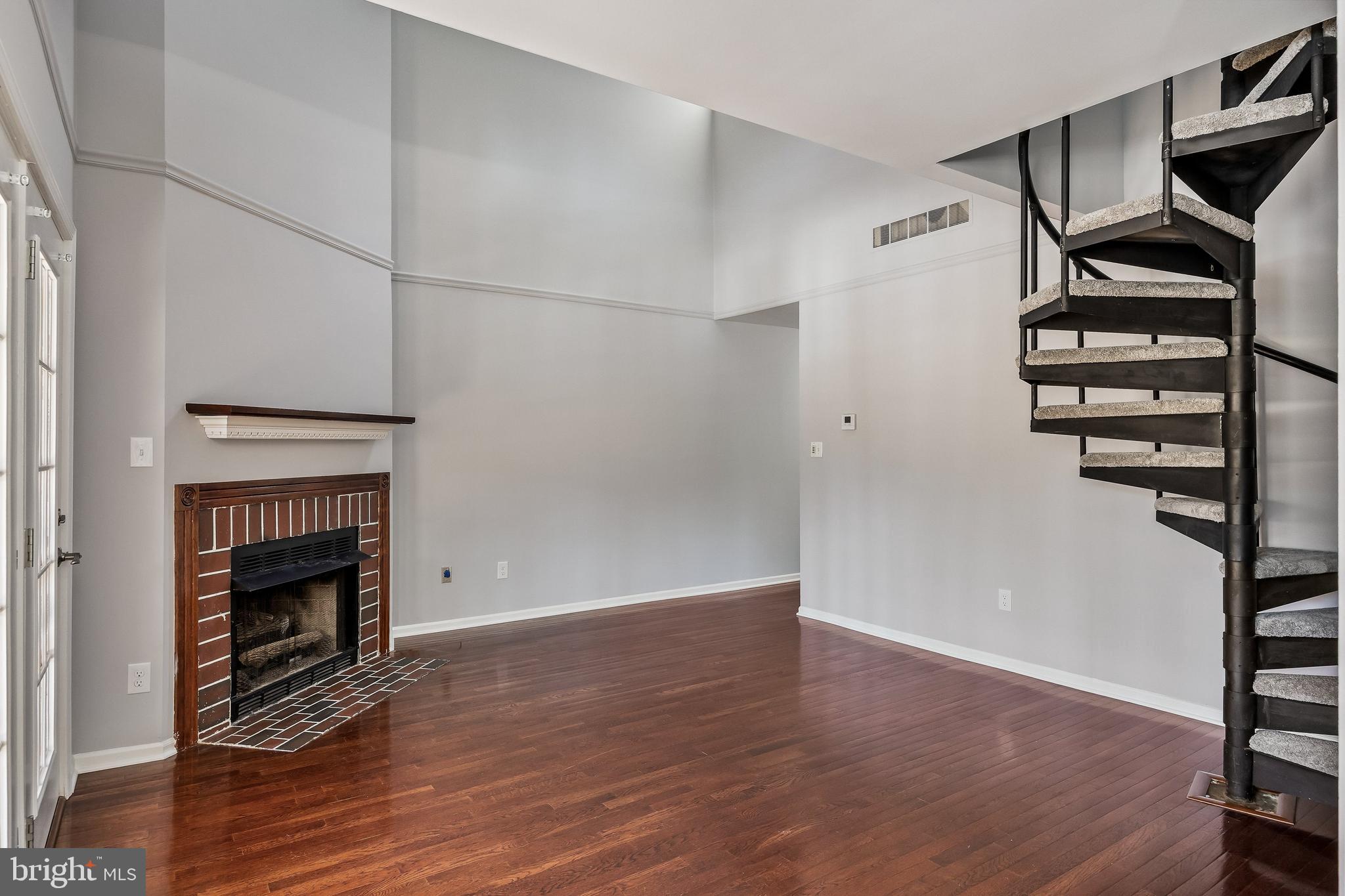 321 Tavistock Road Cherry Hill, NJ 08034 - Photo 5 of 25 an empty room with wooden floor entryway and windows
