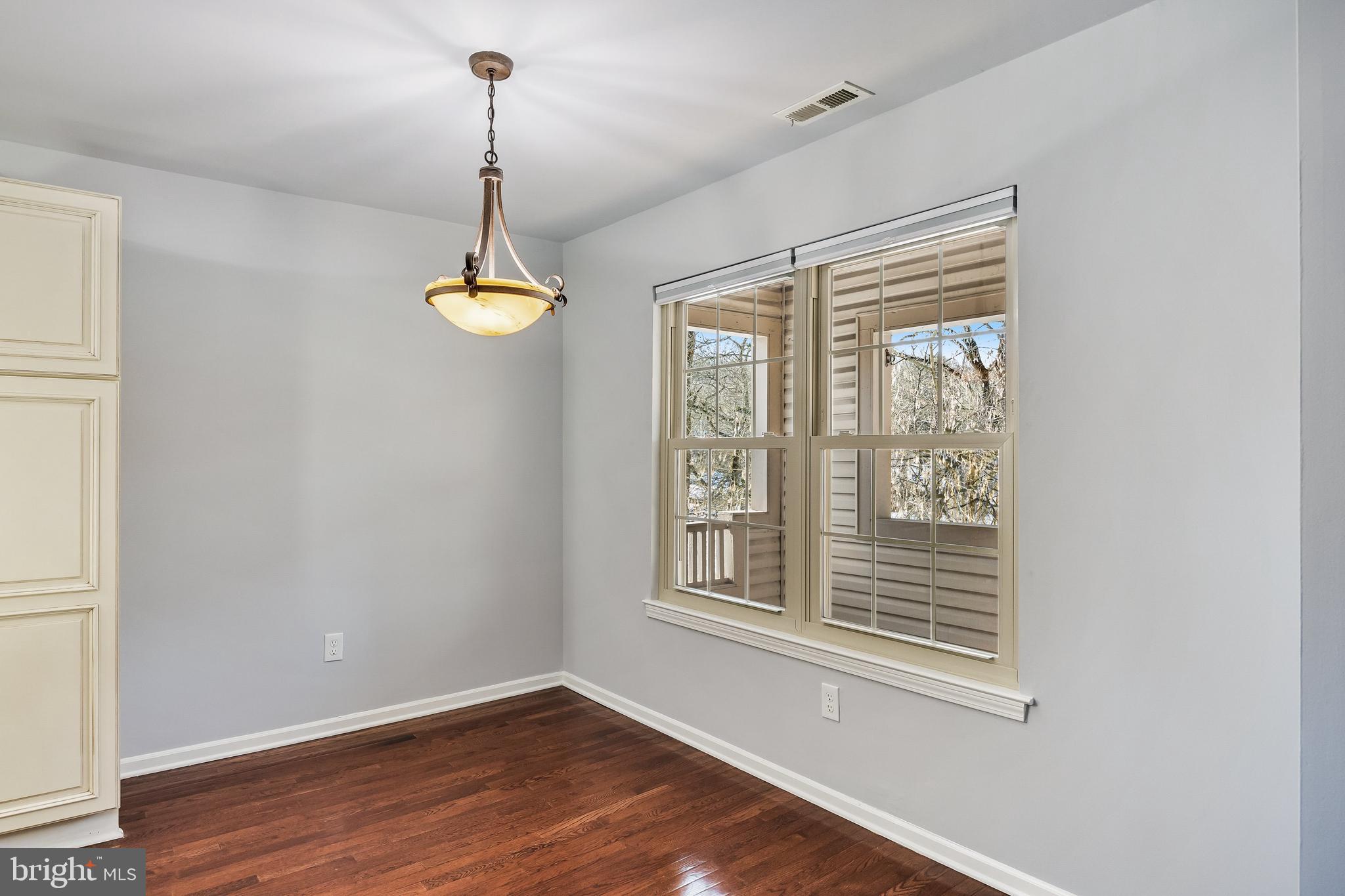 321 Tavistock Road Cherry Hill, NJ 08034 - Photo 6 of 25 a view of a room with wooden floor windows and cabinet