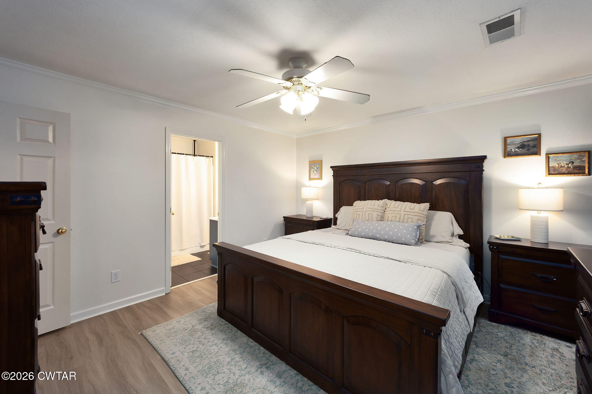 80 Rooker Drive Jackson, TN 38305 - Photo 14 of 30 a bedroom with a bed and a chandelier