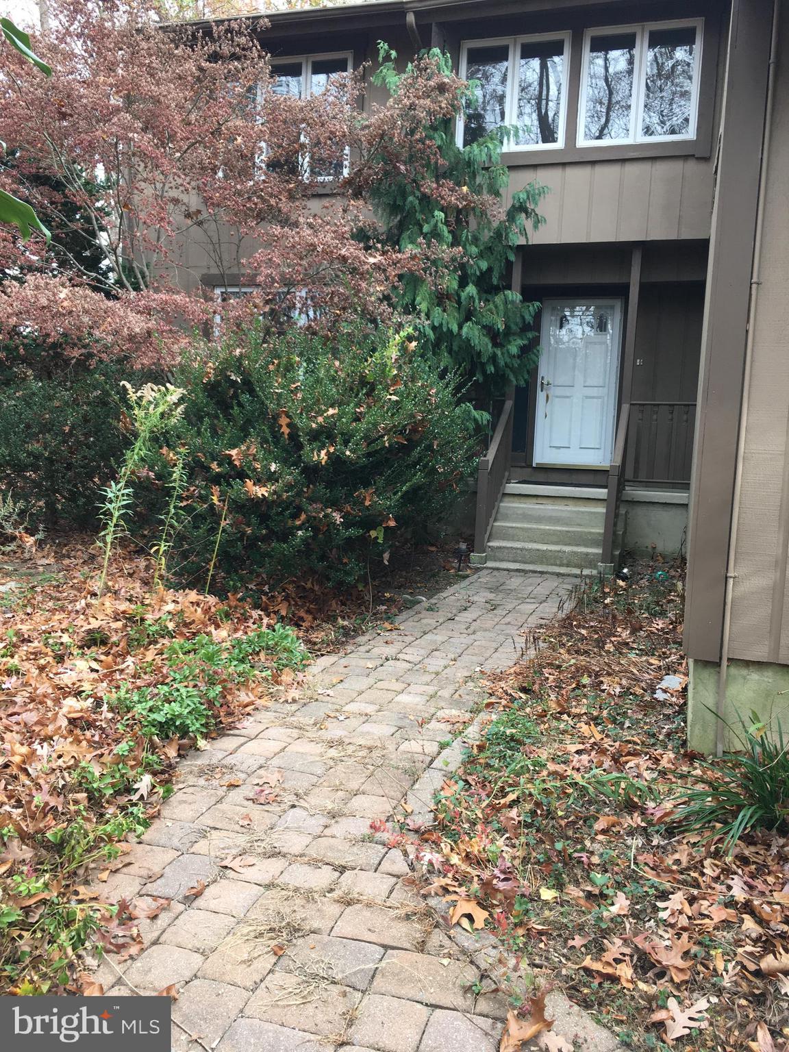 a house with trees in front of it
