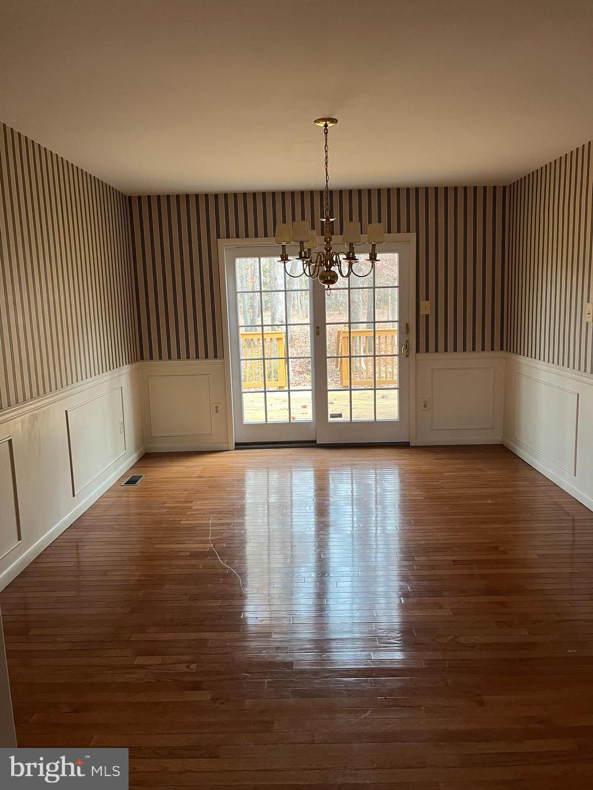221 Irick Road Westampton, NJ 08060 - Photo 4 of 6 a view of an empty room with wooden floor and a window