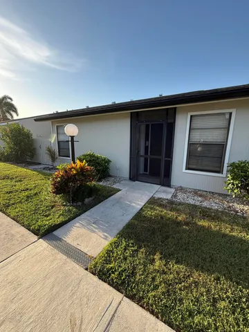 a house view with a garden space