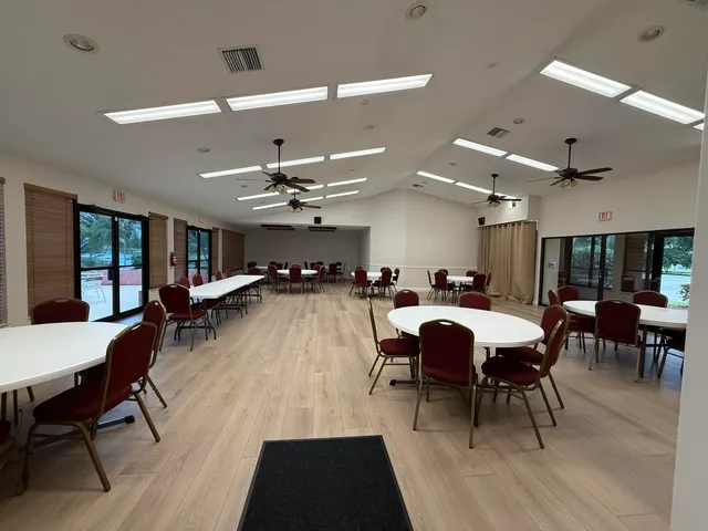 a kitchen with a sink a stove and cabinets