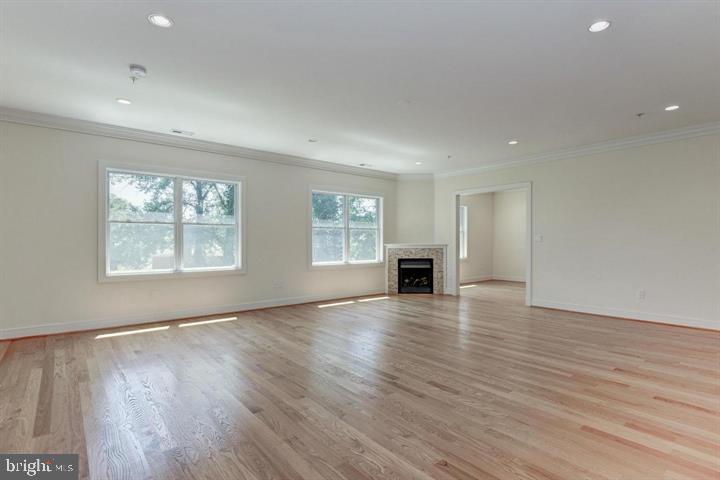 9830 River Road Potomac, MD 20854 - Photo 17 of 31 an empty room with wooden floor and windows