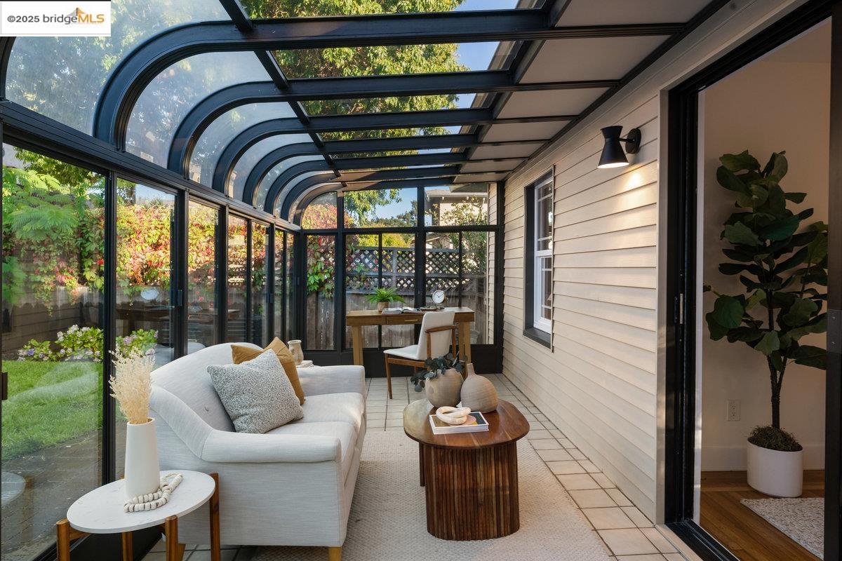 3056 California Street Oakland, CA 94602 - Photo 26 of 44 Sunroom / solarium featuring tile patterned flooring and wooden walls