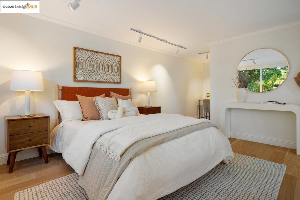 3056 California Street Oakland, CA 94602 - Photo 38 of 44 Bedroom with rail lighting, light wood-type flooring, and crown molding