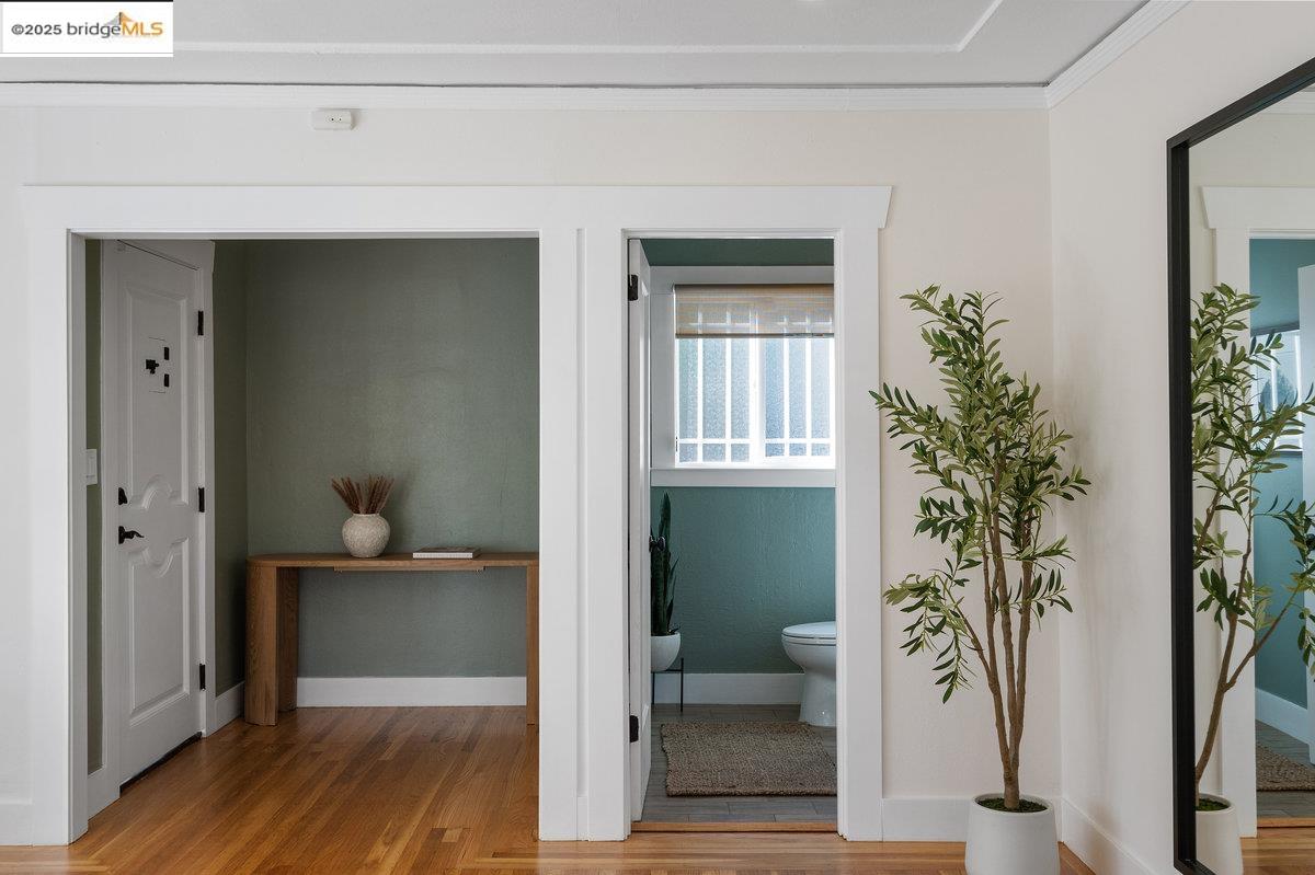 3056 California Street Oakland, CA 94602 - Photo 7 of 44 Corridor featuring light wood-style floors and crown molding