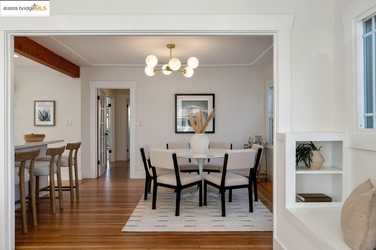 3056 California Street Oakland, CA 94602 - Photo 9 of 44 Dining space featuring wood finished floors, a chandelier, and beamed ceiling